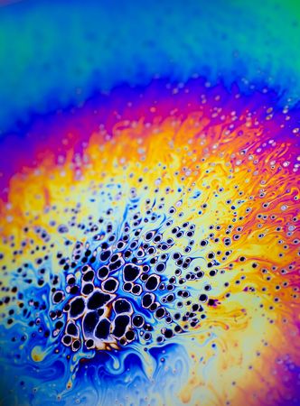 Macro Image of refracted light on a soap bubbleの写真素材