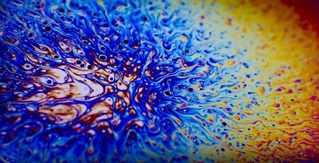 Psychedelic Abstract Macro of the oily surface of a soap bubbleの写真素材