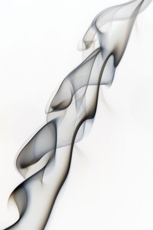 A plum of smoke ripples upward, isolated on whiteの写真素材