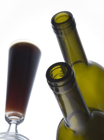 A dark beverage and a bottle, mirrored imageの写真素材