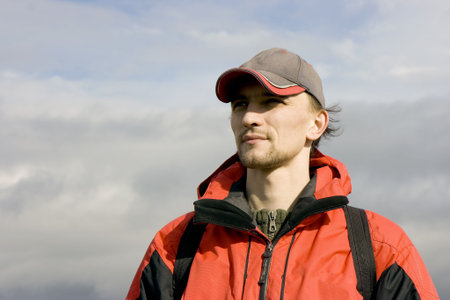 of the man in sportswear against the cloudy sky