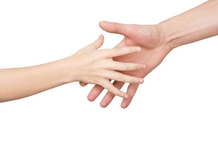 The palm of the child reaches for a hand of the man on a white backgroundの写真素材