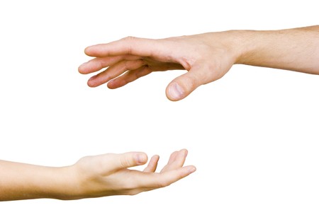 child's hand reaches for the male hand on a white background
の写真素材