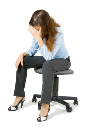 young girl sitting on a chair arm covering her face
の写真素材