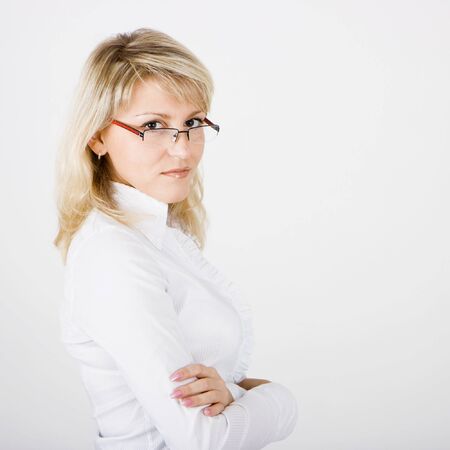 young business woman with glasses on a white backgroundの写真素材