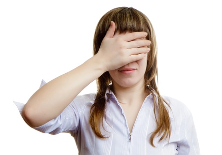 young girl closes her eyes on a white backgroundの写真素材