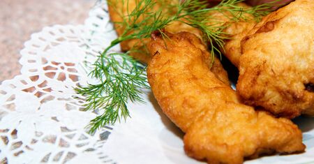 fish in batter on a plate. Festive tableの写真素材