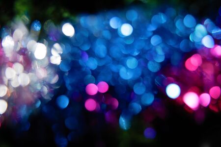 festive background  Blurred reflections on black background  の写真素材