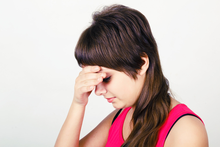 headache. A young attractive woman suffering from headacheの写真素材