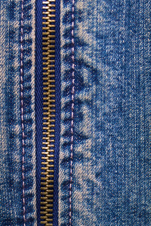 metal zipper with denim. close up. macroの写真素材