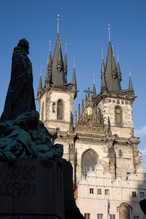 St. Teyn gothic cathedral on Old Town Square with silhouette of Jan Hus statue. Prague, Czech Republic, Europe.の写真素材