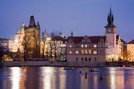 Smetana embankment in Prague with city houses at night illumination. Winter view.の写真素材