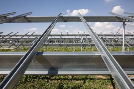 Construction of solar power plant with clouds.の写真素材