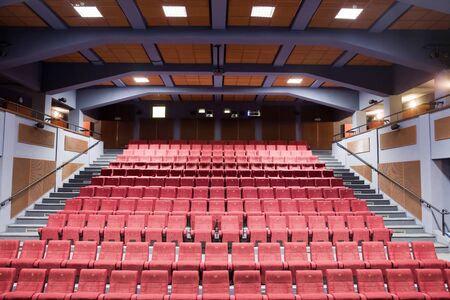 Interior of cinema auditorium with lines of chairs.の写真素材