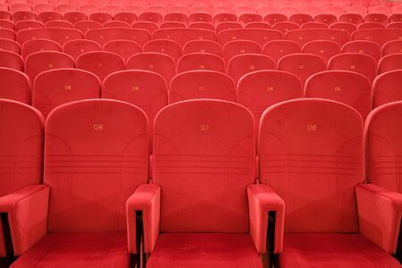 Chair #7. Empty cinema auditorium with lines of red chairs.の写真素材