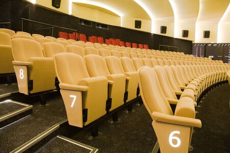 Interior of cinema auditorium with lines of chairs.の写真素材