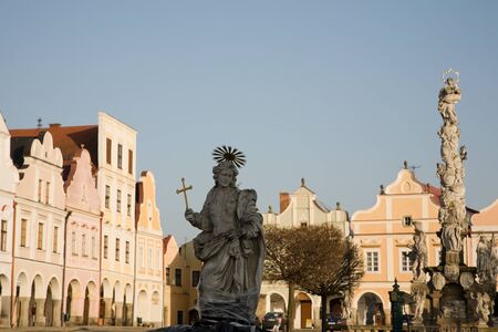 Facade of old city houses with arcades on squareの写真素材