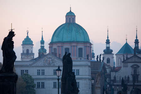 Charles bridge statues with New Town towers in Pragueの写真素材