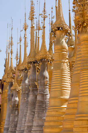 Shwe Inn Thein Paya, Indein, Burma. Weather-beaten buddhistic zedi constructed in 17th and 18th century damaged by earthquake in 1975, partitialy back reconstructed.の写真素材