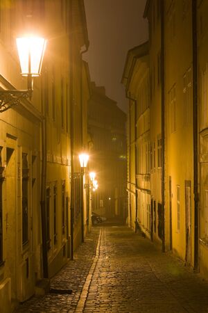 Old lane in Prague Little Quarter at night lighting.の写真素材