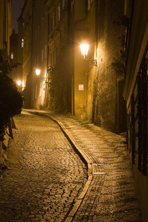 Old lane in Prague Little Quarter at night lighting.の写真素材