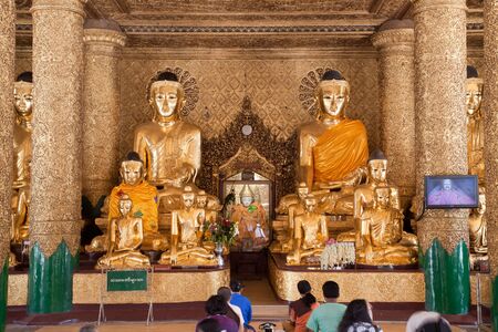 The biggest Buddhist temple Shwedagon pagoda with praying Buddhist people, Rangoon, Burma.のeditorial素材