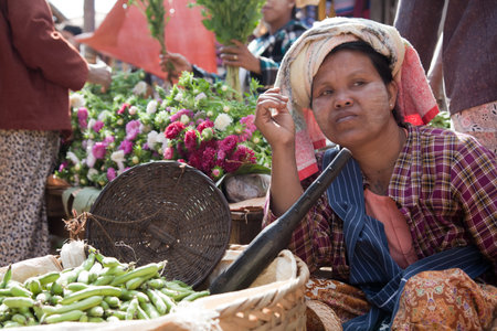 BURMA, PINDAYA - FEBRUARY 23: Farmers are selling home-made food products on the street market. Pindaya, Burma.のeditorial素材