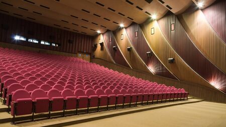 PR (property release) available. Empty cinema auditorium with line of chairs. Side view.の写真素材