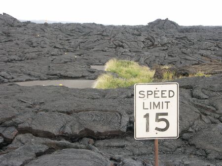 Volcano lava field with traffic sign.の写真素材