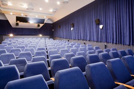 PR (property release) available. Empty cinema auditorium with line of chairs. Front view.の写真素材