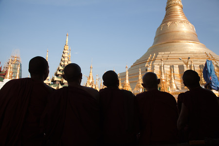 BURMA, RANGOON, SHWEDAGON PAGODA - FEBRUARY 11, 2011: Monks in the biggest Buddhist temple Shwedagon pagoda.のeditorial素材