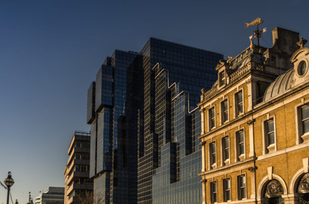 View of the two buildings, a combination of old and new architecture, glass and brickの写真素材