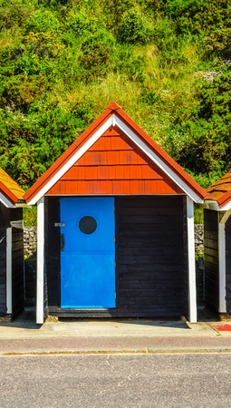 Colored houses on the beach, colorful door to summer cottages, seaside spot, sunny dayのeditorial素材