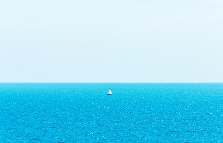 Ocean infinity, yacht sailing the ocean, clear sky, blue water, recreational sportの写真素材