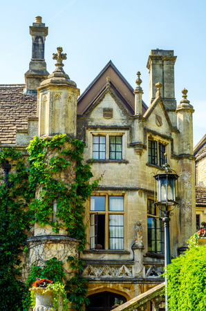 Old building stylized for historical castle, characteristic turrets, beautiful windows, stone statues, vintageの写真素材