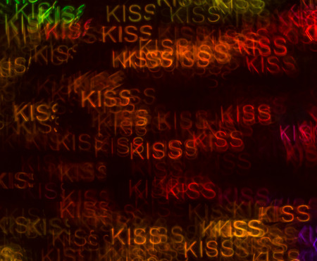 Beautiful background with different colored word kissの写真素材