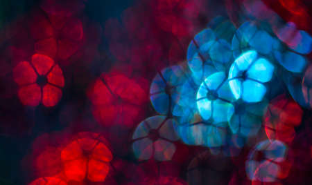 Beautiful background with different colored  flower, abstract background, flower shapes on black background  , blurryの写真素材