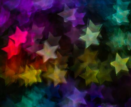 Beautiful background with different colored  star, abstract background, star shapes on black background, blurryの写真素材