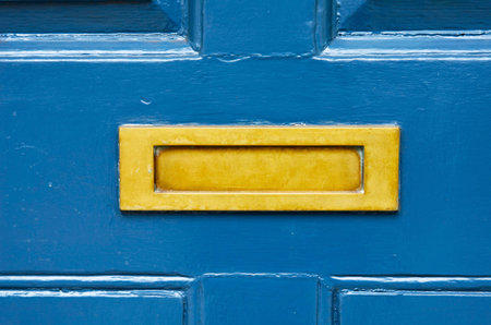Old letterbox in the door, traditional way of delivering letters to the house, old mailbox, correspondenceの写真素材
