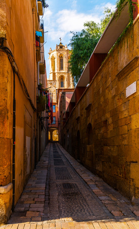 Charming narrow street, street with colorful facades of buildings, vintage style, sunny dayの写真素材