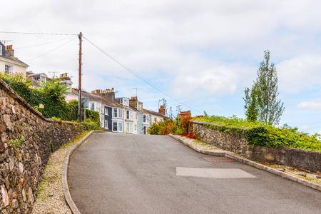 street in a seaside town, with colorful facades of buildings, english architecture, travelの写真素材