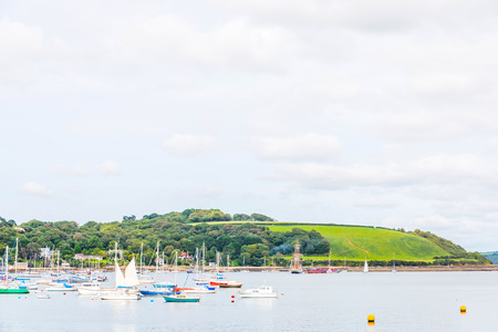 Boats and ships moored in a small port, in the background coastal town, fishing industry and tourism, shipsの写真素材