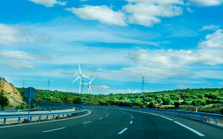 Fast road in the mountains in Spain, beautiful landscape of mountains, dry earth and rock from the sun, transportationの写真素材
