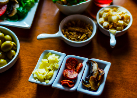Set with different appetizers in small portions, healthy and delicious snacks, diet foodの写真素材