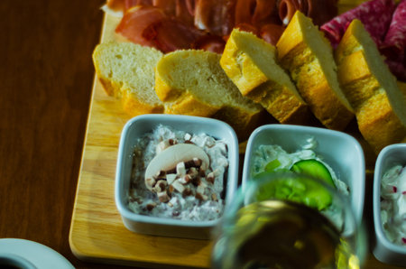 set of snacks with white cheese and cucumber, radish, mushroom, healthy and tasty snacks, breakfast...