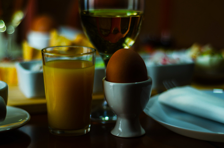 Breakfast set with egg in egg-cup, fresh bread, healthy and tasty food in the morning, breakfastの写真素材