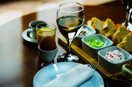 Breakfast set with egg in egg-cup, fresh bread, healthy and tasty food in the morning, breakfastの写真素材