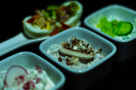set of snacks with white cheese and cucumber, radish, mushroom, healthy and tasty snacks, breakfast setの写真素材