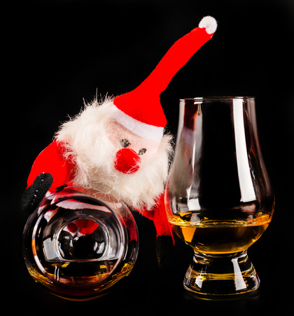 Santa Claus with single malt whiskey glass, Symbol of Christmas holiday, Xmas set, decorationの写真素材