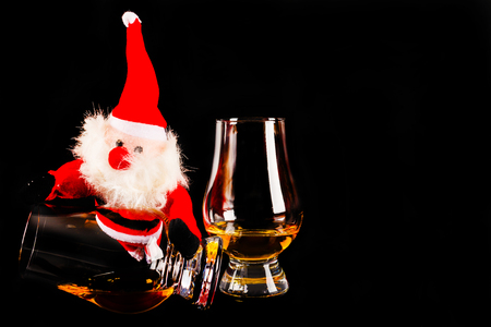 Santa Claus with single malt whiskey glasses, Symbol of Christmas holiday, Xmas set, decorationの写真素材